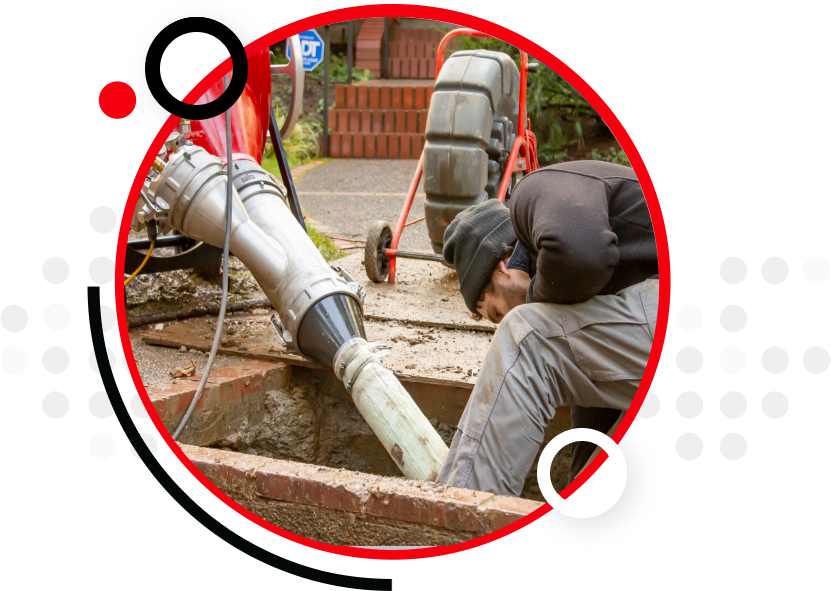 Service technician working on a sewer pipe.